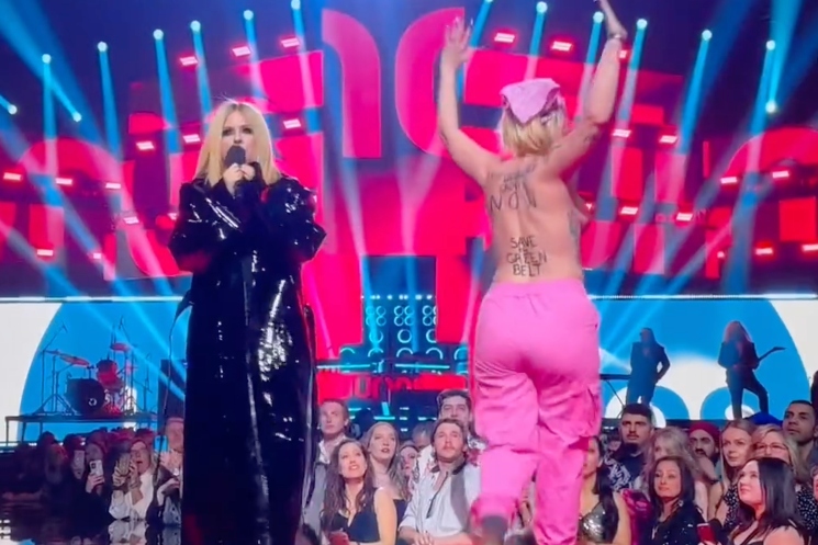 Avril Lavigne Flicks Topless Protestor's Boob at JUNO Awards: 'Get the Fuck Off, Bitch' 